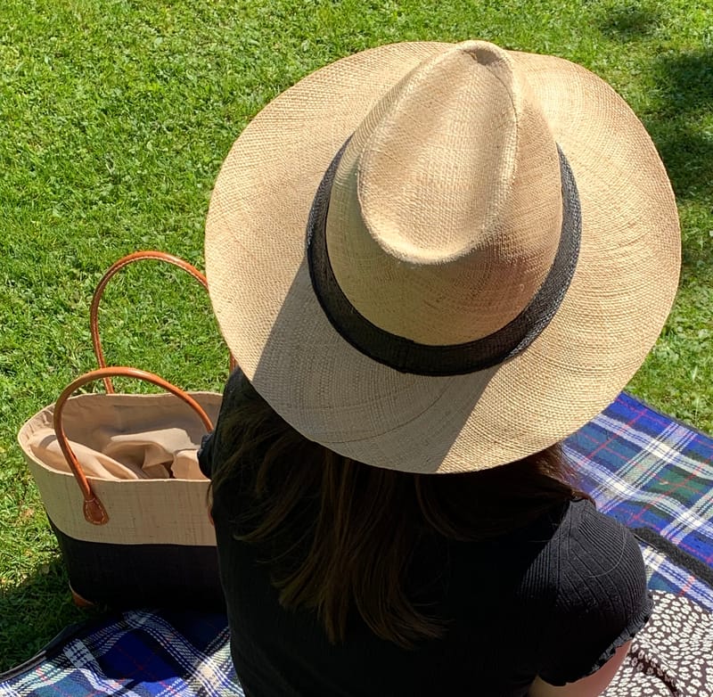 Raffia Panama hat with a Black Band and a Two Tone Hanta Basket